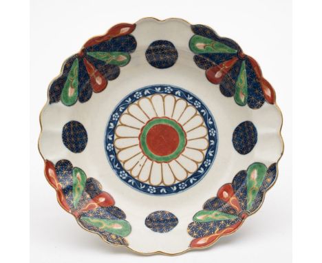 A First Period Worcester saucer dish: painted in the 'Old Japan Fan' pattern in underglaze blue, polychrome and gilt with fan