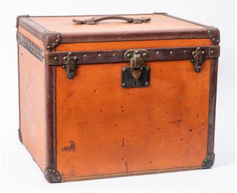 A Louis Vuitton canvas and leather bound travelling cabin trunk: of square outline, the leather handle stamped L Vuitton, to 