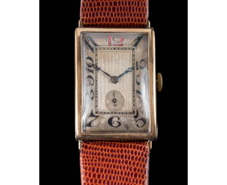 A gentleman's 9ct gold cased manual wind wristwatch: the rectangular dial with Arabic numerals and subsidiary dial, on brown 