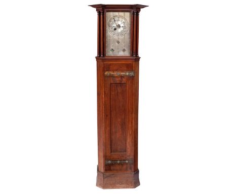 An Art &amp; Crafts oak longcase clock: the eight-day duration weight-driven movement striking the hours on a bell with the r