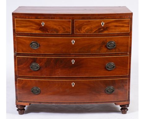 An early 19th Century mahogany and inlaid bow-fronted chest:, bordered with boxwood and ebony lines, the top with a crossband