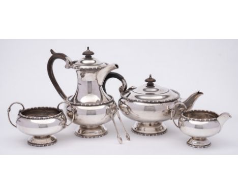 An Elizabeth II silver four-piece tea service, maker Walker &amp; Hall, Sheffield, 1959: of circular outline, with bobbin ree