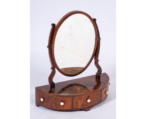 A George III mahogany and inlaid half round platform toilet mirror:, with an oval swing frame plate in chequer feather strung