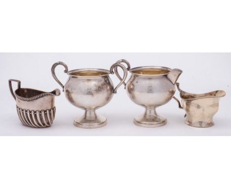 A Sterling silver pedestal cream jug and matching sugar basin, stamped marks: a Victorian silver cream jug with half reeded d