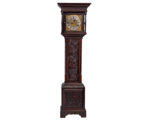 John Green of Skipton, a carved oak longcase clock: the eight-day duration movement striking the hours on a bell, the 12 inch