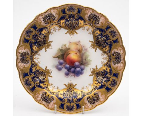 A Royal Worcester fruit painted cabinet plate by Richard Sebright: the centre painted with peaches, grapes and blossom, the c