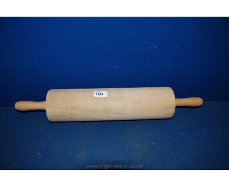 A very large Wooden Rolling Pin.