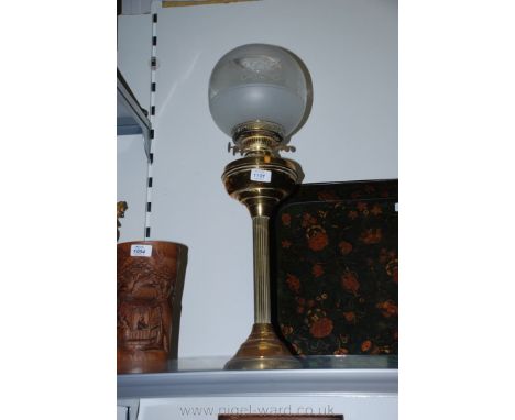 A Brass column Oil Lamp with frosted glass shade.