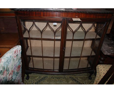 A late 19th c. Mahogany bow fronted china Display Cabinet, with pair of opposing seven pane glazed doors opening to reveal tw