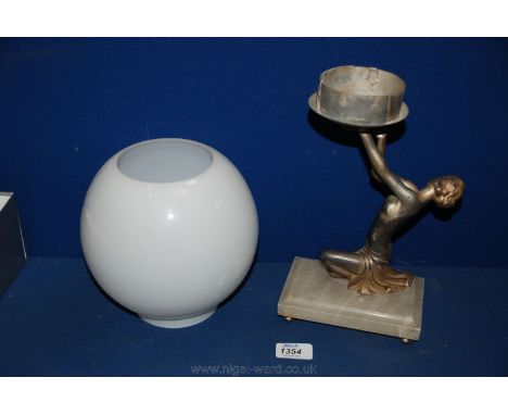 An Art Deco Lamp of a kneeling figure on Alabaster base holding a globe shade (shade not original).