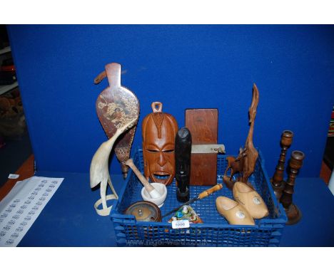 A quantity of wooden items including tie press, pair of candlesticks, wooden deer, pair of clogs, etc.