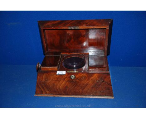 A flame Mahogany Sarcophagus Tea Caddy, as found