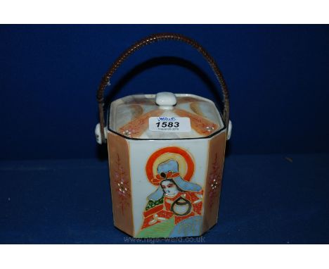 A Japanese 'Samurai' Tea Caddy with bound wooden handle.