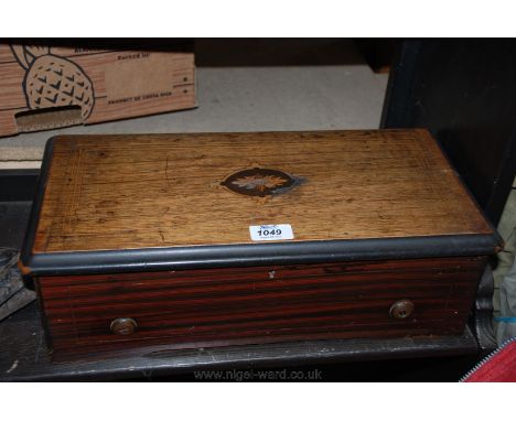 A Mahogany cased table top cylinder Music Box, playing eight airs including Pirates of Penzance  