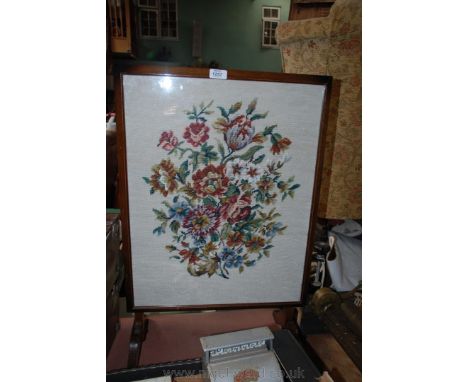 A floral tapestry folding Firescreen/Table.