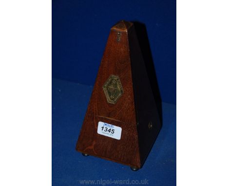 A Mahogany French Metronome by Paquet.