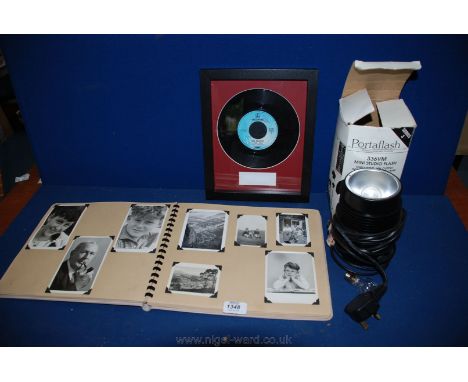 An old Photograph Album, a Portaflash mini-studio Flash Head and Modelling Lamp, and The Beatles 'I Feel Fine' framed Single,