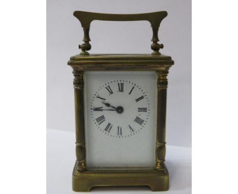 CARRIAGE CLOCK, brass column frame carriage clock with bevelled glass panels, 12cm height 