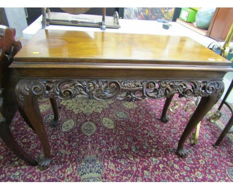 GEORGIAN DESIGN CARVED WALNUT CONSOLE TABLE, with carved foliate and pierced frieze with claw feet, 107cm width 