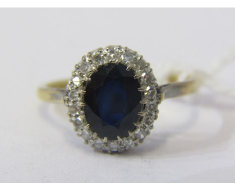 SAPPHIRE &amp; DIAMOND CLUSTER RING, 18ct yellow gold ring set an oval sapphire, surrounded by a cluster of diamonds, size O 