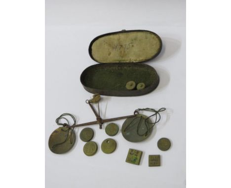 ANTIQUE POCKET SCALES, original oval tin box pocket scales with assorted weights, interior lid dated 1775 
