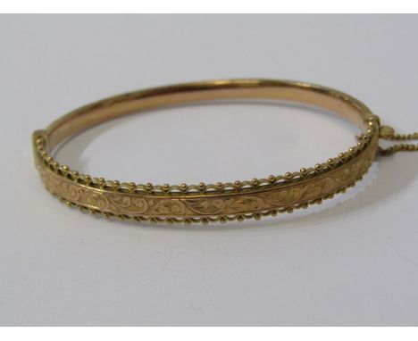 HINGED GOLD BANGLE, 9ct yellow gold hinged bangle, with foliate decoration, 6.4 grams 