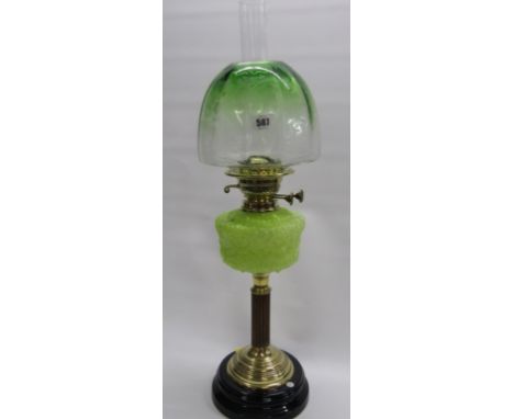 EDWARDIAN OIL LAMP, brass column support with relief design yellow glass reservoir and etched green glass shade 