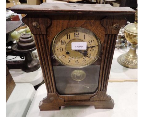 Oak cased chiming mantel clock with pendulum. Not available for in-house P&amp;P 