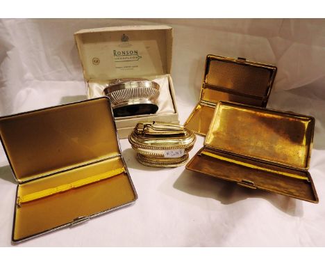 Two Ronson Georgian style table lighters, one boxed, together with three vintage cigarette cases including a gold plated exam