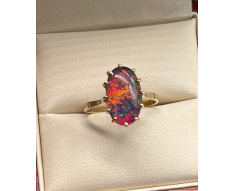 9ct yellow gold ladies ring set with a faux opal stone. [Ring size K] [1.88Grams] 