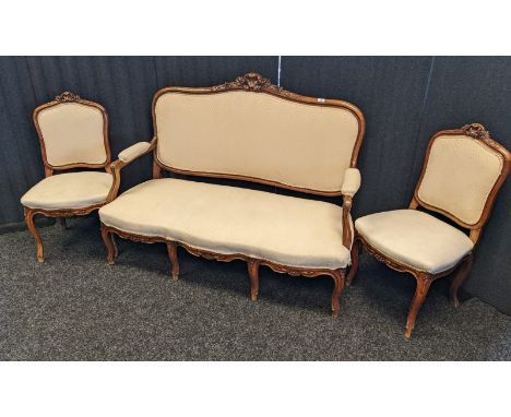 Antique French three piece parlour sofa, Two seat sofa and two single chairs. Mahogany frames and light material upholstery [