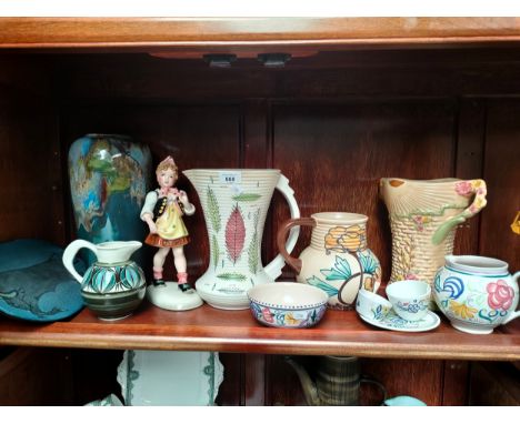 A Shelf of collectables includes Royal cauldron 1930 jugs by Edith gater, Poole pottery jug and bowl , Arthur wood art deco 1