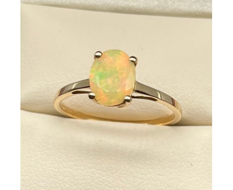 10ct yellow gold ladies ring set with a single Ethiopian opal stone. [Ring size R] [1.66Grams] 