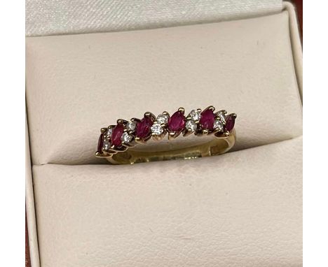 14ct yellow gold ruby and diamond ring, set with alternating navette cut rubies and pairs of round cut diamonds, all to a pla