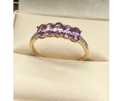 10ct yellow gold ladies ring set with purple and white topaz stones. [Ring size R] [2.04Grams] 