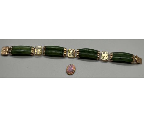 A Chinese gilt metal and green jade bracelet together with a opalescent style stone. 