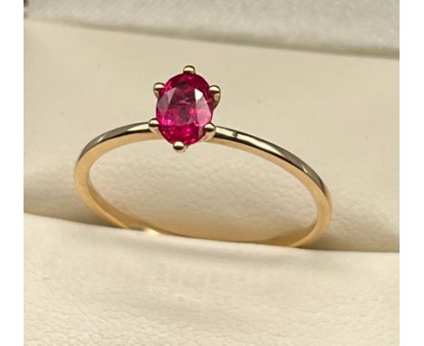 10ct yellow gold ladies ring set with a single ruby cut stone. [Ring size R] [1.26Grams] 