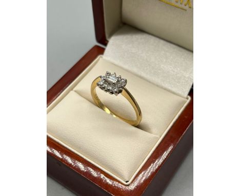 18ct yellow gold ladies diamond ring. Set with a baguette cut diamond surrounded by round cut diamonds. 0.50ct diamonds. [Rin