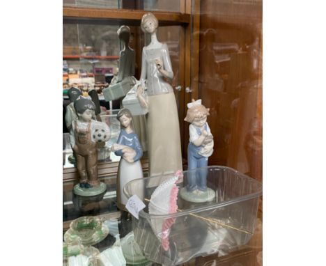 A Collection of Lladro &amp; Nao figurines to include the footballer, Girl holding doll etc 