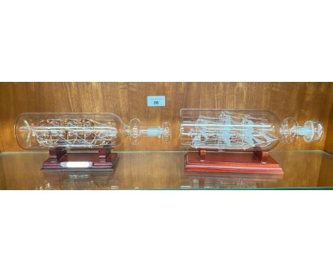 2 Vintage Ships in glass bottles on display stand includes Hms victory 