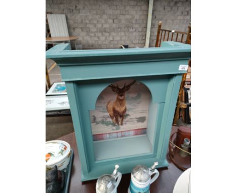 Converted grandfather clock top made into a wall light, showing deer background. 