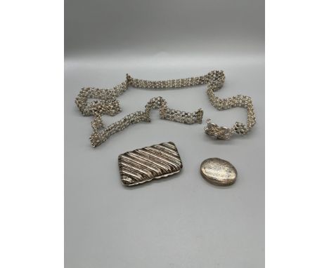 Sterling silver oval shaped pill box, Birmingham silver snuff box and silver woven eastern belt. 