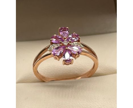 10ct yellow gold ladies ring set with purple &amp; white topaz stones, designed in a flower shape. [Ring size R] [2.50grams] 