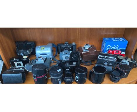 A Large collection of cameras &amp; lenses to include Polaroid, Kodak baby hawkeye, various lenses includes Olympus etc 