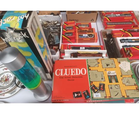 A Vintage lava lamp along with selection of vintage games includes Monopoly etc 