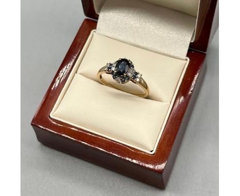 9ct yellow gold sapphire and diamond ring. [Ring size R] [2.56grams] 