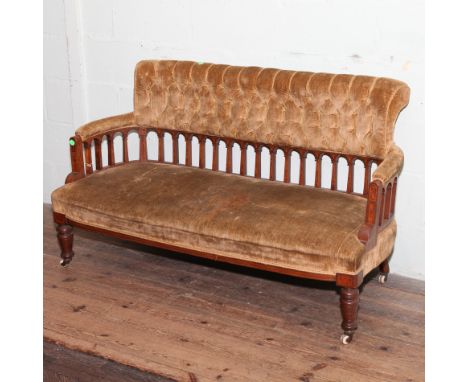 Late Victorian/Edwardian mahogany framed settee with inlaid spindles to the comb style back, with gold upholstered seat and b