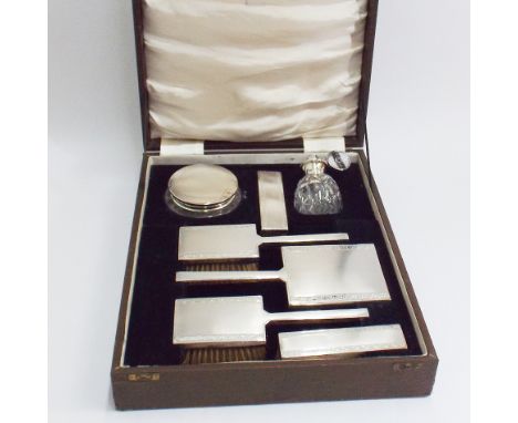 1950's silver 7 piece dressing table set comprising hand mirror, pair of hand brushes, pair of clothes brushes, scent bottles