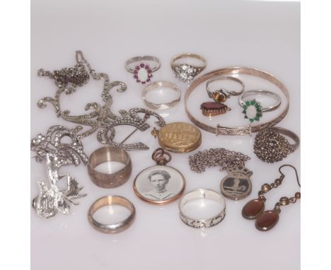 Silver charm bracelet, bangle, rings and brooches etc, everything in lot weighs 128 grams