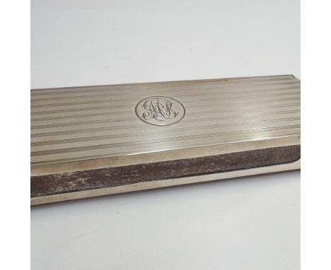 Long Edwardian silver match box holder, with old Bryant & May vesta box inside, engine turned decoration to the top and engra